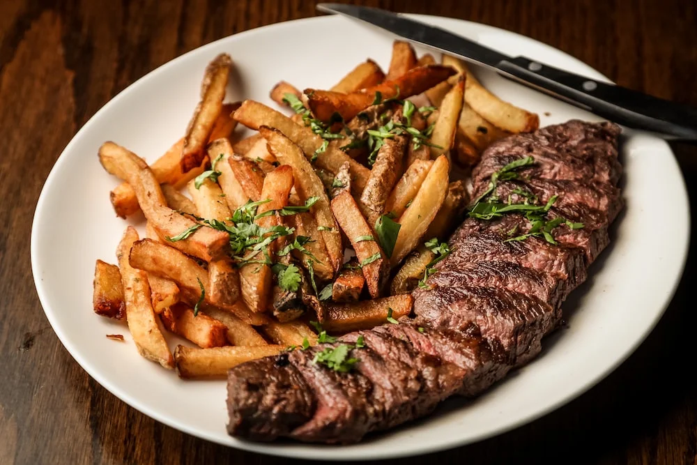 Wood-fired seasonal skillet served at our Montgomery Calgary steakhouse