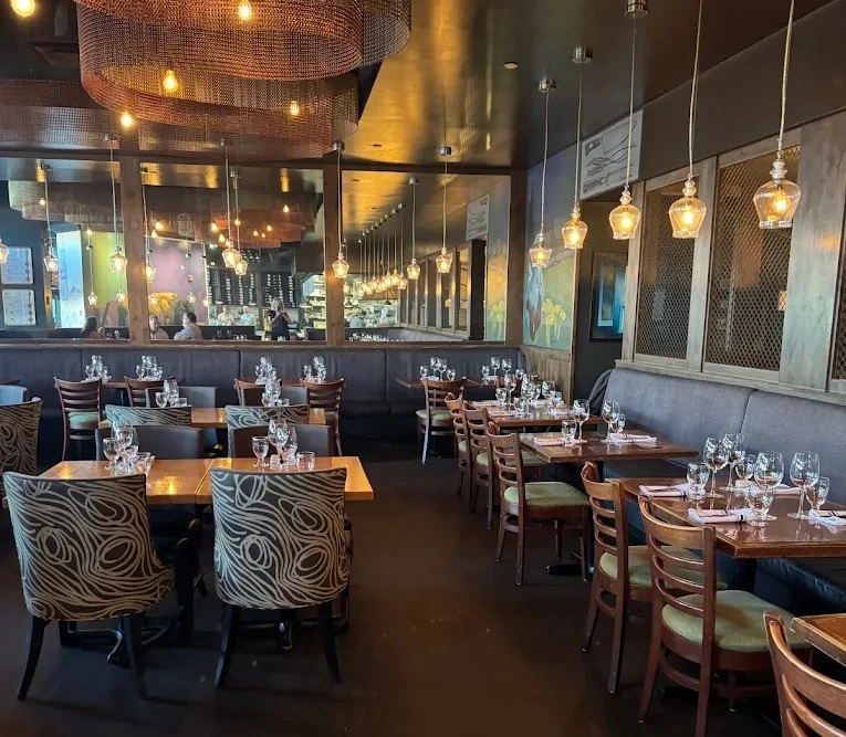 The private dining room at NOTABLE - The Steakhouse in Montgomery, Calgary, set for a group dinner